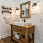 A small farmhouse bathroom with white shiplap and a wooden floating vanity. Farmhouse Bathroom Ideas